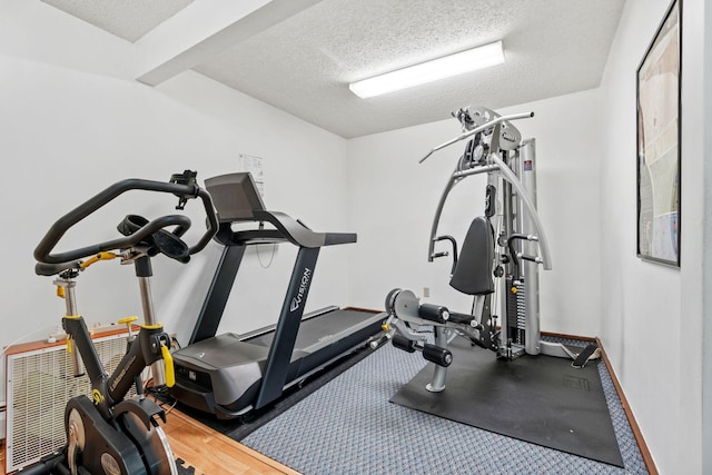 2801 Flag Ave N Unit 314, New Hope, MN 55427 - workout area featuring a textured ceiling and baseboards