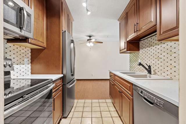 2801 Flag Ave N Unit 314, New Hope, MN 55427 - kitchen with stainless steel appliances, ceiling fan, decorative backsplash, and light countertops