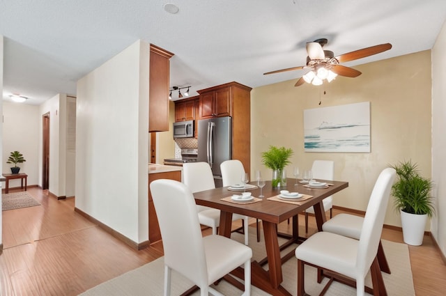 2801 Flag Ave N Unit 314, New Hope, MN 55427 - dining space featuring ceiling fan and light wood finished floors