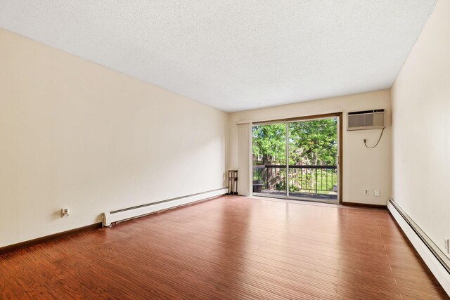 2801 Flag Ave N Unit 314, New Hope, MN 55427 - unfurnished room with baseboard heating, a wall mounted air conditioner, wood finished floors, and a textured ceiling