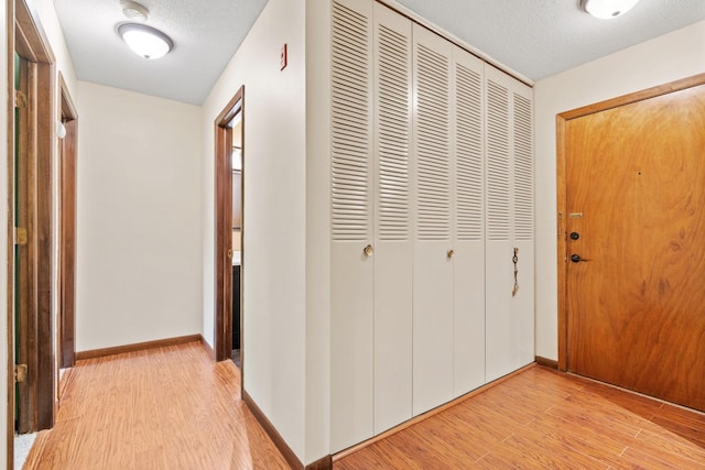 2801 Flag Ave N Unit 314, New Hope, MN 55427 - hall featuring light wood-style floors and a textured ceiling