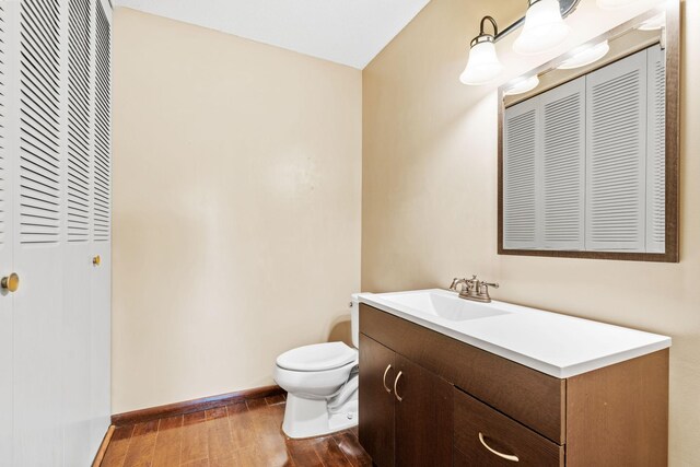 2801 Flag Ave N Unit 314, New Hope, MN 55427 - half bathroom featuring a closet, wood finished floors, and vanity