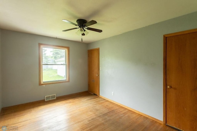1820 5th St S, Moorhead, MN 56560 - unfurnished room featuring light wood-style floors and ceiling fan