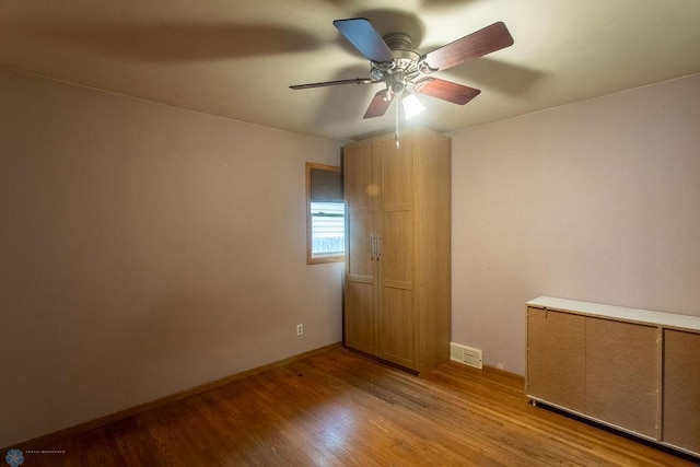 1820 5th St S, Moorhead, MN 56560 - unfurnished room with wood finished floors and ceiling fan