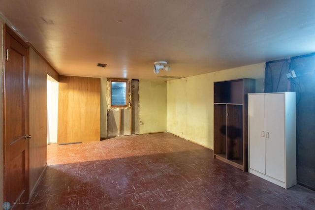 1820 5th St S, Moorhead, MN 56560 - spare room with tile patterned floors and wood walls