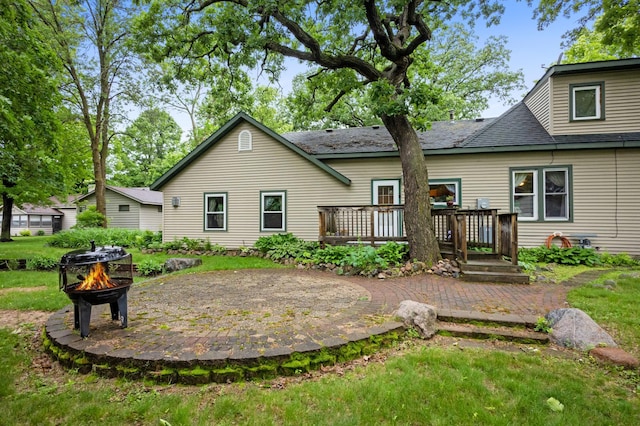 2606 Sessions St NW, Alexandria, MN 56308 - back of house with an outdoor fire pit and a deck