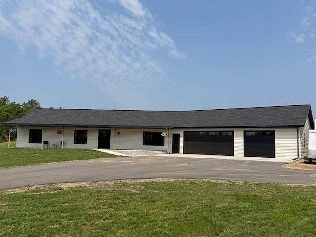 16696 Eclipse Dr, Park Rapids, MN 56470 - ranch-style home featuring asphalt driveway, an attached garage, and a front lawn