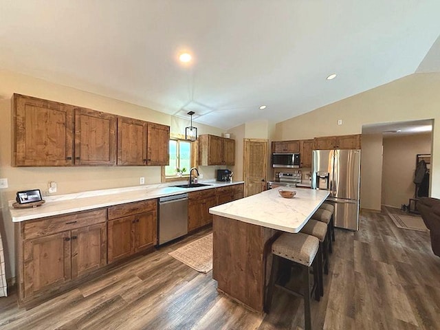 16696 Eclipse Dr, Park Rapids, MN 56470 - kitchen with stainless steel appliances, dark wood-style floors, light countertops, a center island, and lofted ceiling
