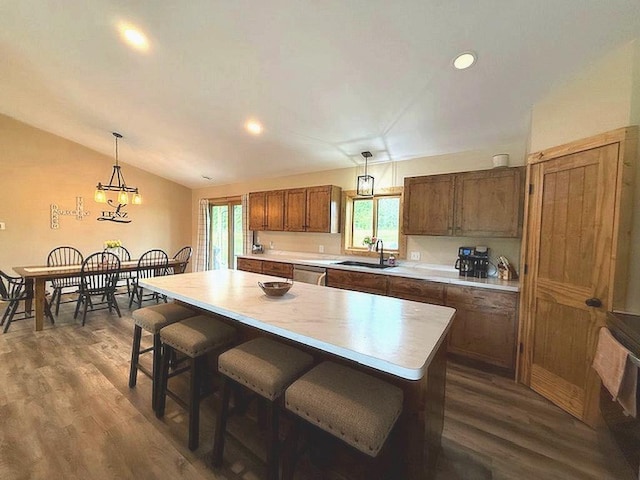 16696 Eclipse Dr, Park Rapids, MN 56470 - kitchen featuring light countertops, dark wood-style flooring, pendant lighting, dishwasher, and lofted ceiling