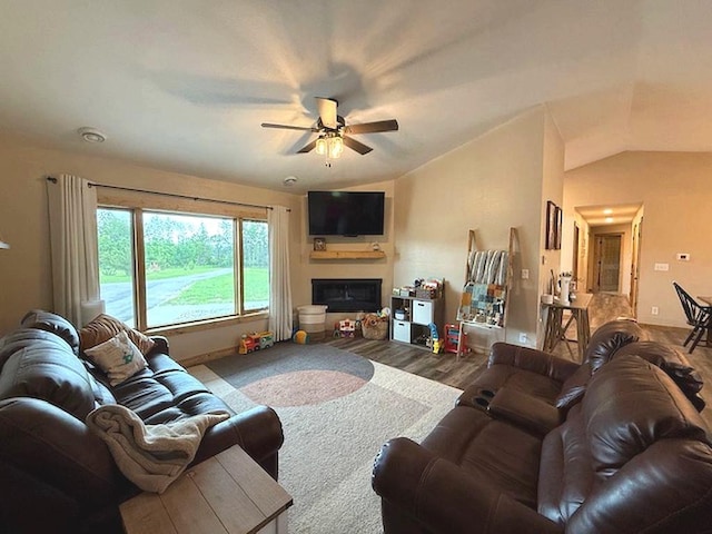 16696 Eclipse Dr, Park Rapids, MN 56470 - living room with a ceiling fan, lofted ceiling, a fireplace, and wood finished floors