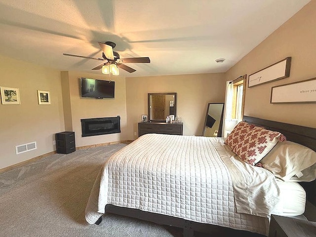 16696 Eclipse Dr, Park Rapids, MN 56470 - carpeted bedroom featuring a fireplace and a ceiling fan