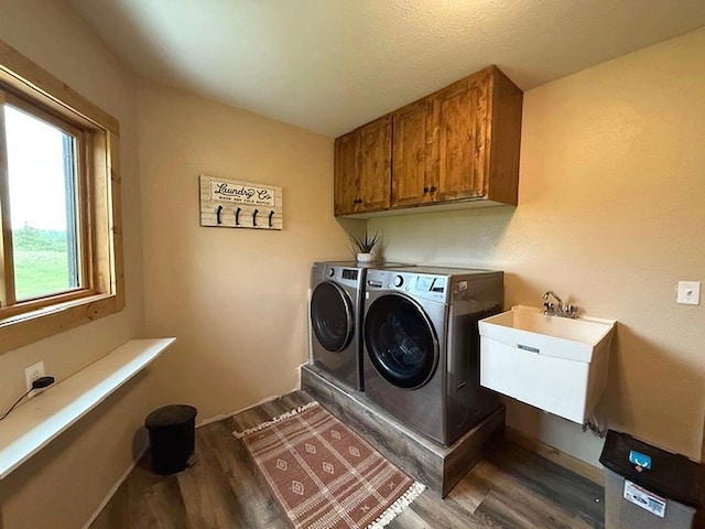 16696 Eclipse Dr, Park Rapids, MN 56470 - laundry area with washer and clothes dryer, wood finished floors, and cabinet space