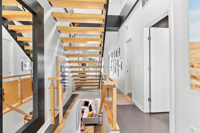 3880 Green Heights Trl SW, Prior Lake, MN 55372 - stairs featuring tile patterned flooring and a towering ceiling