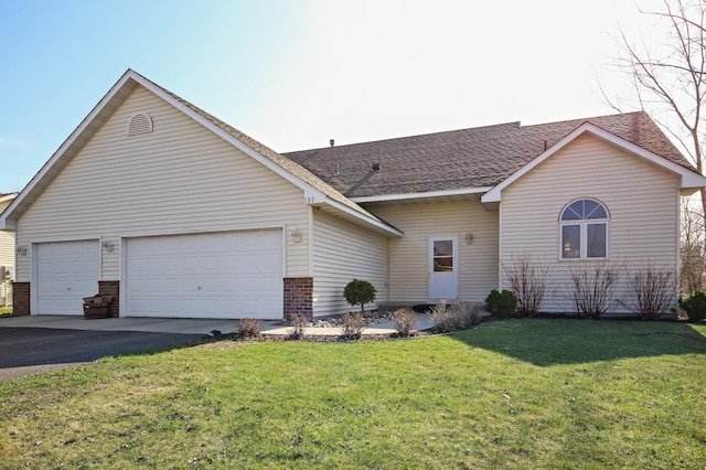 139 Dakota Ave, Elko New Market, MN 55054 - ranch-style house featuring asphalt driveway, a front yard, a shingled roof, and brick siding