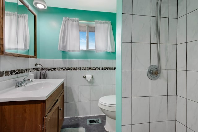 1388 13 1/2 Ave, Barron, WI 54812 - full bathroom with tile walls, vanity, tiled shower, and a wainscoted wall