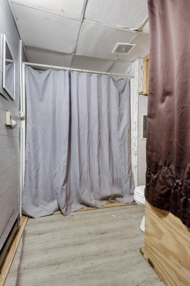 1388 13 1/2 Ave, Barron, WI 54812 - bathroom with wood finished floors and a shower with shower curtain