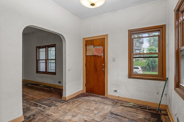 693 Bedford St, Saint Paul, MN 55130 - entrance foyer featuring hardwood / wood-style flooring, arched walkways, and a textured wall