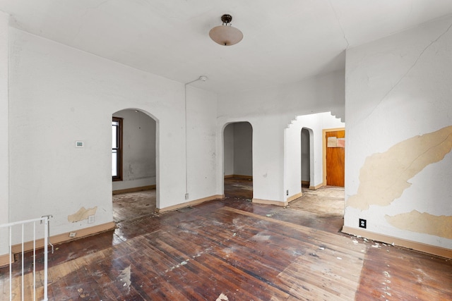 693 Bedford St, Saint Paul, MN 55130 - empty room with arched walkways and hardwood / wood-style flooring