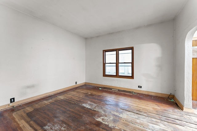 693 Bedford St, Saint Paul, MN 55130 - unfurnished room featuring hardwood / wood-style floors and arched walkways
