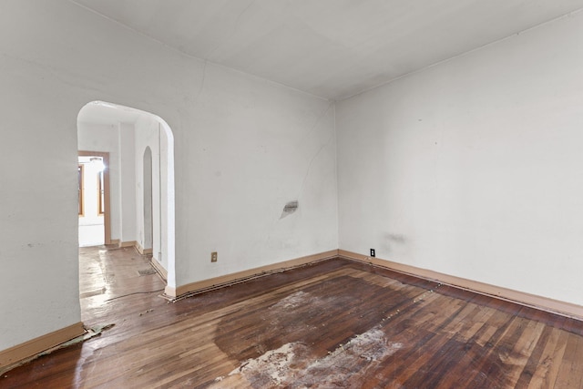 693 Bedford St, Saint Paul, MN 55130 - unfurnished room featuring arched walkways and wood-type flooring