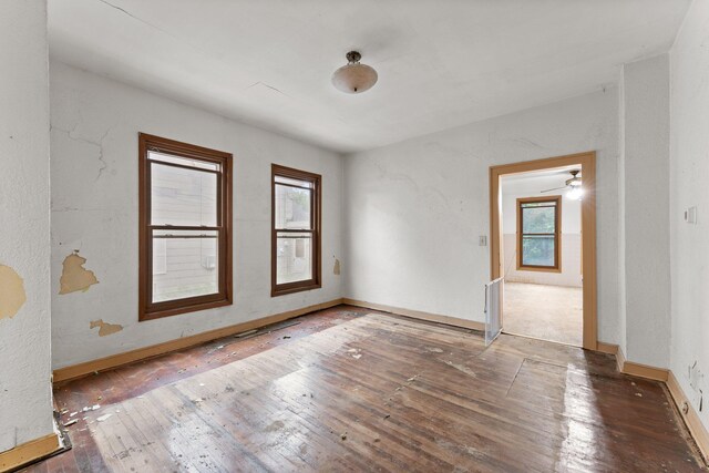 693 Bedford St, Saint Paul, MN 55130 - unfurnished room featuring hardwood / wood-style flooring and baseboards