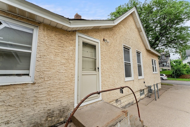 693 Bedford St, Saint Paul, MN 55130 - view of property exterior with a chimney
