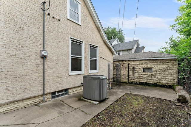 693 Bedford St, Saint Paul, MN 55130 - view of home's exterior featuring a central AC unit and a patio area