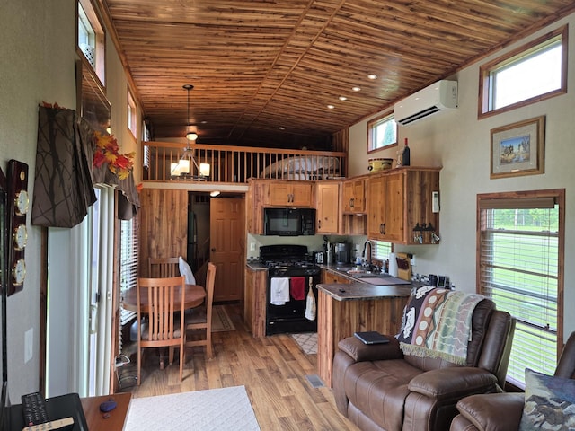20389 640th Ln, Jacobson, MN 55752 - kitchen featuring black appliances, a wall unit AC, wooden ceiling, dark countertops, and light wood-style floors