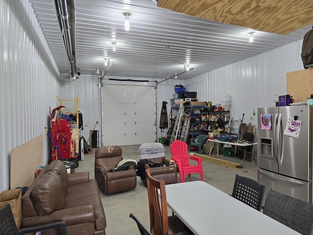 20389 640th Ln, Jacobson, MN 55752 - garage featuring stainless steel fridge with ice dispenser