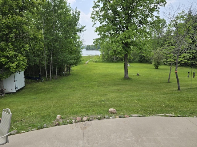 20389 640th Ln, Jacobson, MN 55752 - view of grassy yard featuring a water view and a storage unit
