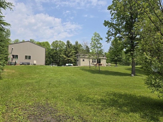 20389 640th Ln, Jacobson, MN 55752 - view of grassy yard with an outdoor structure and a pole building