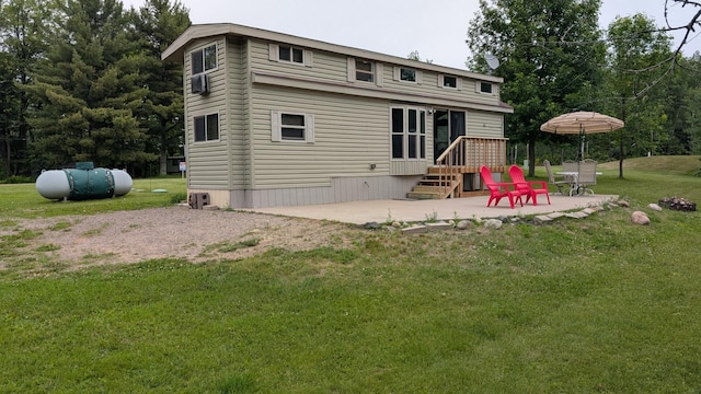 20389 640th Ln, Jacobson, MN 55752 - rear view of property featuring a patio area and a lawn