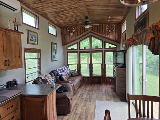 20389 640th Ln, Jacobson, MN 55752 - living area featuring wood ceiling, a wall mounted air conditioner, ceiling fan, high vaulted ceiling, and wood finished floors