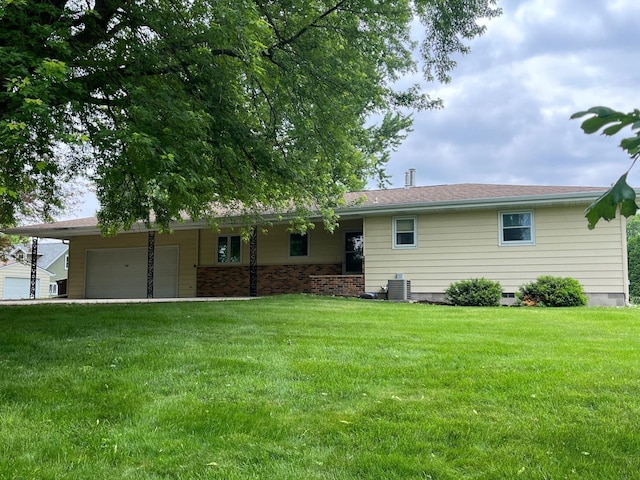 200 Amsterdam Ave E, Hollandale, MN 56045 - rear view of house with an attached garage and a lawn