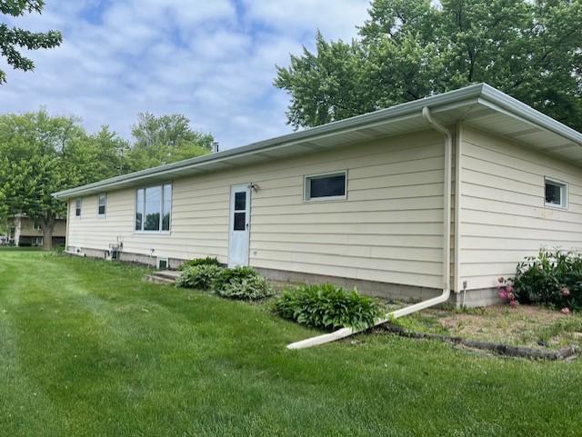 200 Amsterdam Ave E, Hollandale, MN 56045 - rear view of property with a lawn