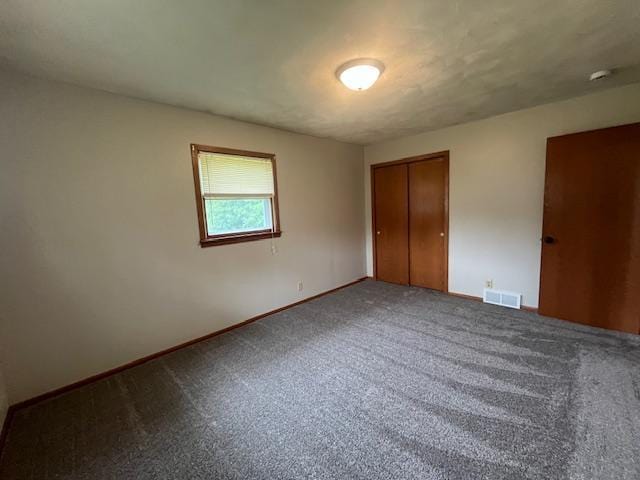 200 Amsterdam Ave E, Hollandale, MN 56045 - unfurnished bedroom with a closet and carpet floors