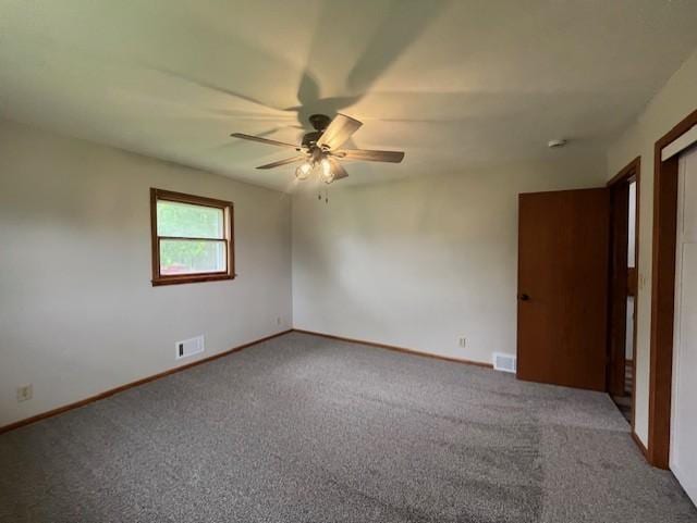 200 Amsterdam Ave E, Hollandale, MN 56045 - unfurnished bedroom featuring carpet flooring and a ceiling fan