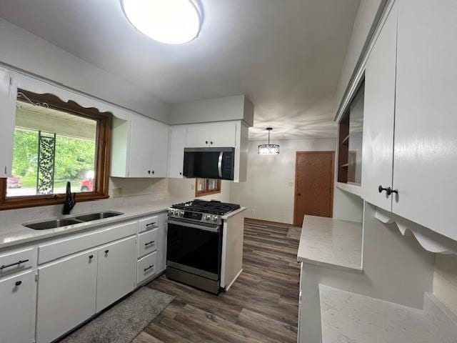 200 Amsterdam Ave E, Hollandale, MN 56045 - kitchen featuring appliances with stainless steel finishes, light countertops, dark wood-style floors, and white cabinets