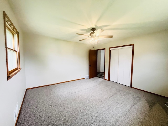 200 Amsterdam Ave E, Hollandale, MN 56045 - unfurnished bedroom featuring carpet floors, a closet, and a ceiling fan