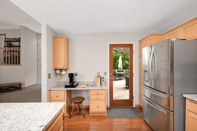 10787 Alison Way, Inver Grove Heights, MN 55077 - kitchen featuring stainless steel fridge, light brown cabinets, light wood-style floors, and built in desk