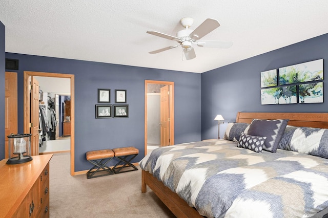 10787 Alison Way, Inver Grove Heights, MN 55077 - bedroom featuring light carpet, a walk in closet, a closet, and ceiling fan