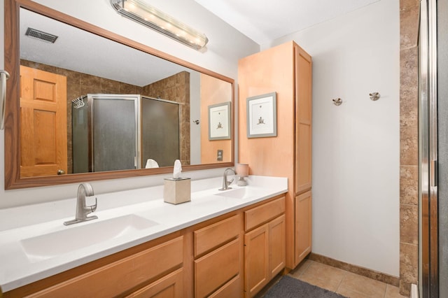 10787 Alison Way, Inver Grove Heights, MN 55077 - bathroom with tile patterned flooring, a shower stall, and double vanity