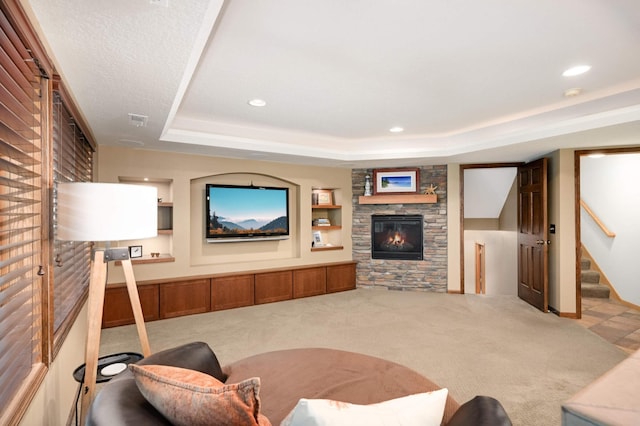 10787 Alison Way, Inver Grove Heights, MN 55077 - carpeted living room with a raised ceiling, a stone fireplace, stairs, and recessed lighting