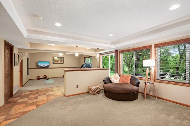 10787 Alison Way, Inver Grove Heights, MN 55077 - living area with a tray ceiling, light colored carpet, a textured ceiling, and recessed lighting
