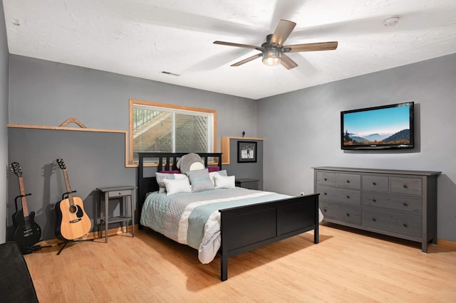 10787 Alison Way, Inver Grove Heights, MN 55077 - bedroom with light wood-style floors and ceiling fan