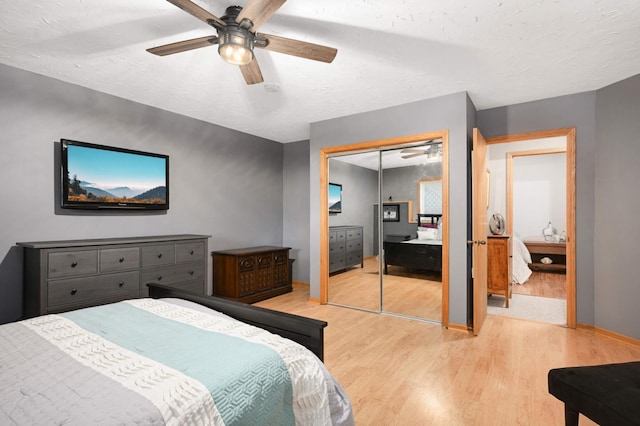 10787 Alison Way, Inver Grove Heights, MN 55077 - bedroom with light wood-type flooring, a ceiling fan, a closet, and a textured ceiling