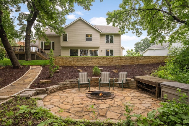 10787 Alison Way, Inver Grove Heights, MN 55077 - view of patio featuring an outdoor fire pit, stairway, and a deck