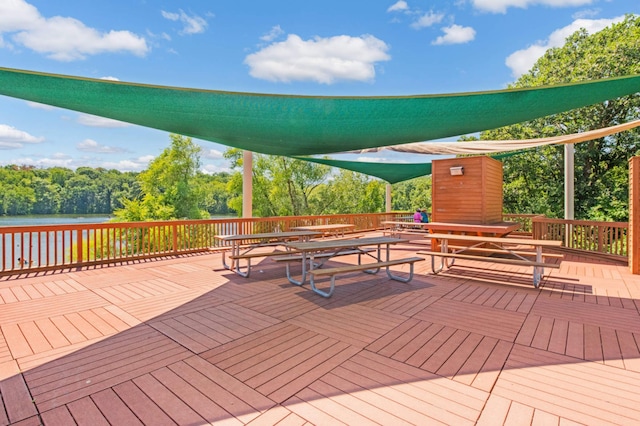 10787 Alison Way, Inver Grove Heights, MN 55077 - wooden deck with outdoor dining area and a water view