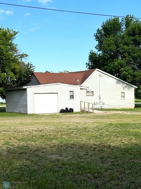 857 Main St, Mahnomen, MN 56557 - view of side of home with a lawn