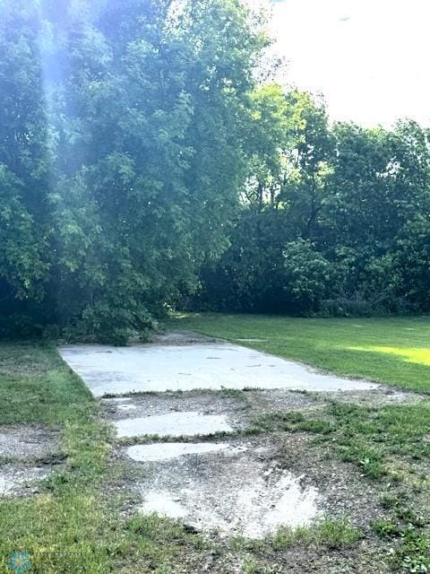 857 Main St, Mahnomen, MN 56557 - view of green lawn with a forest view